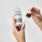 ⁦امبولةالتقشير بالارز الاسود والنياسيناميد من  دكتور ميلاكسين 80مل⁩ - الصورة ⁦2⁩